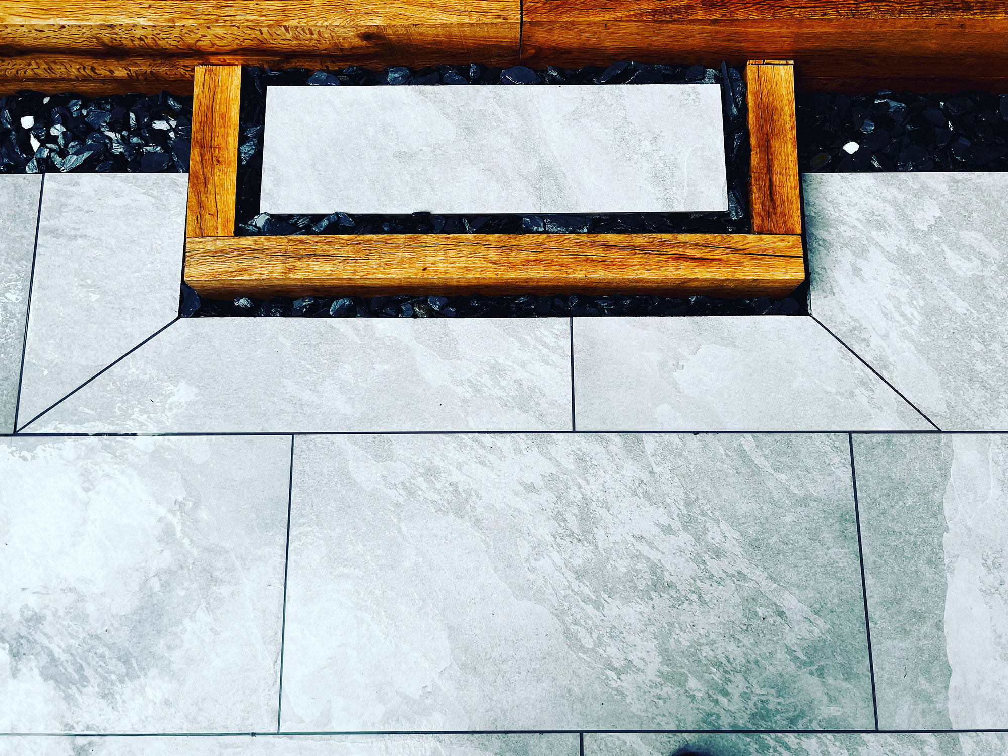 Cheap patio ideas, Elegant Stone and Wood Patio Design Featuring Modern Geometric Patterns and Natural Accents