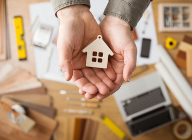 iStock Insurance hands house.jpg